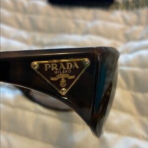 Prada Women’s  Dark Brown Sunglasses w several small scratches on lenses.